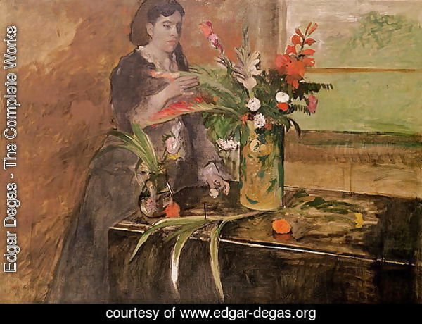 Young woman arranging flowers, 1872