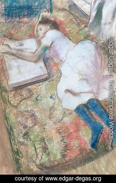 Young Girl Lying Down Looking at an Album, c.1889