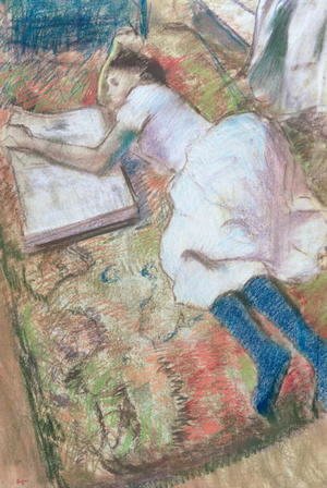 Young Girl Lying Down Looking at an Album, c.1889